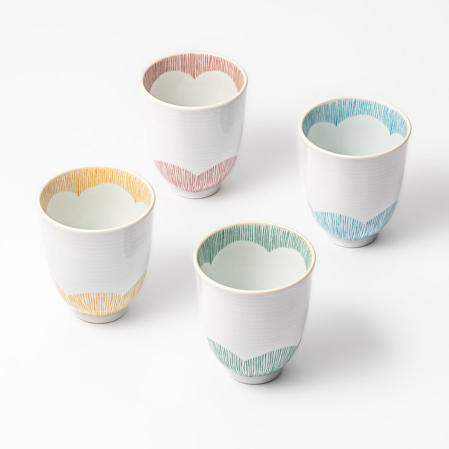 Set of four Japanese ceramic tea cups with plum petal stripe design in red, blue, green, and yellow, perfect for daily tea rituals