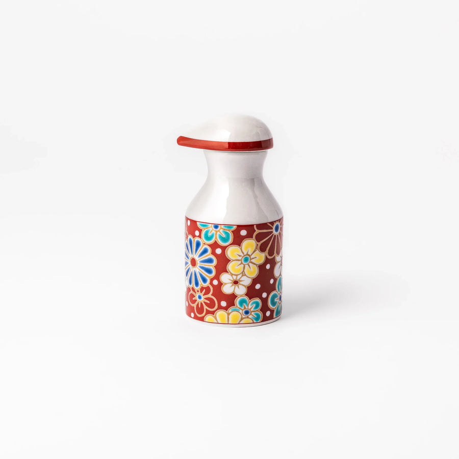 Japanese porcelain soy sauce dispenser with red floral pattern featuring plum and chrysanthemum blossoms, handcrafted design.