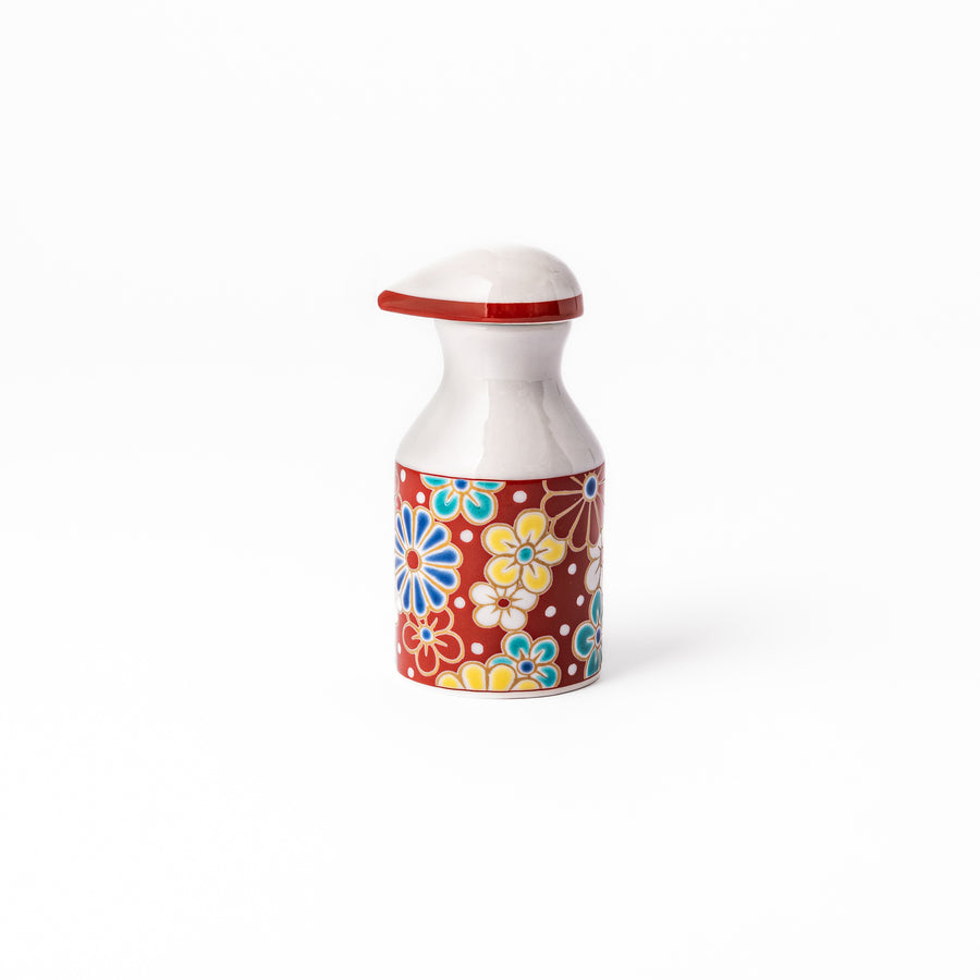 Japanese ceramic soy sauce dispenser with a red lid and colorful plum and chrysanthemum blossom pattern, handcrafted in Arita Japan.