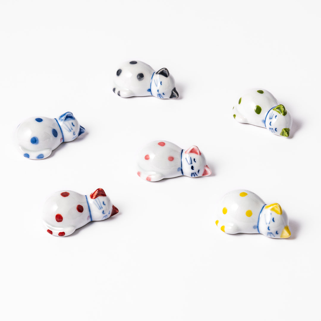 Set of polka dot cat-shaped chopstick rests in various colors, perfect for adding charm and playfulness to Japanese table settings.