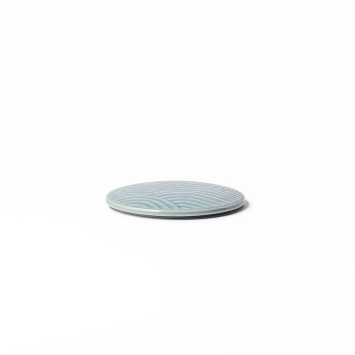 Light blue porcelain lid with embossed Seigaiha wave pattern, crafted to match stackable Japanese bowls beautifully.