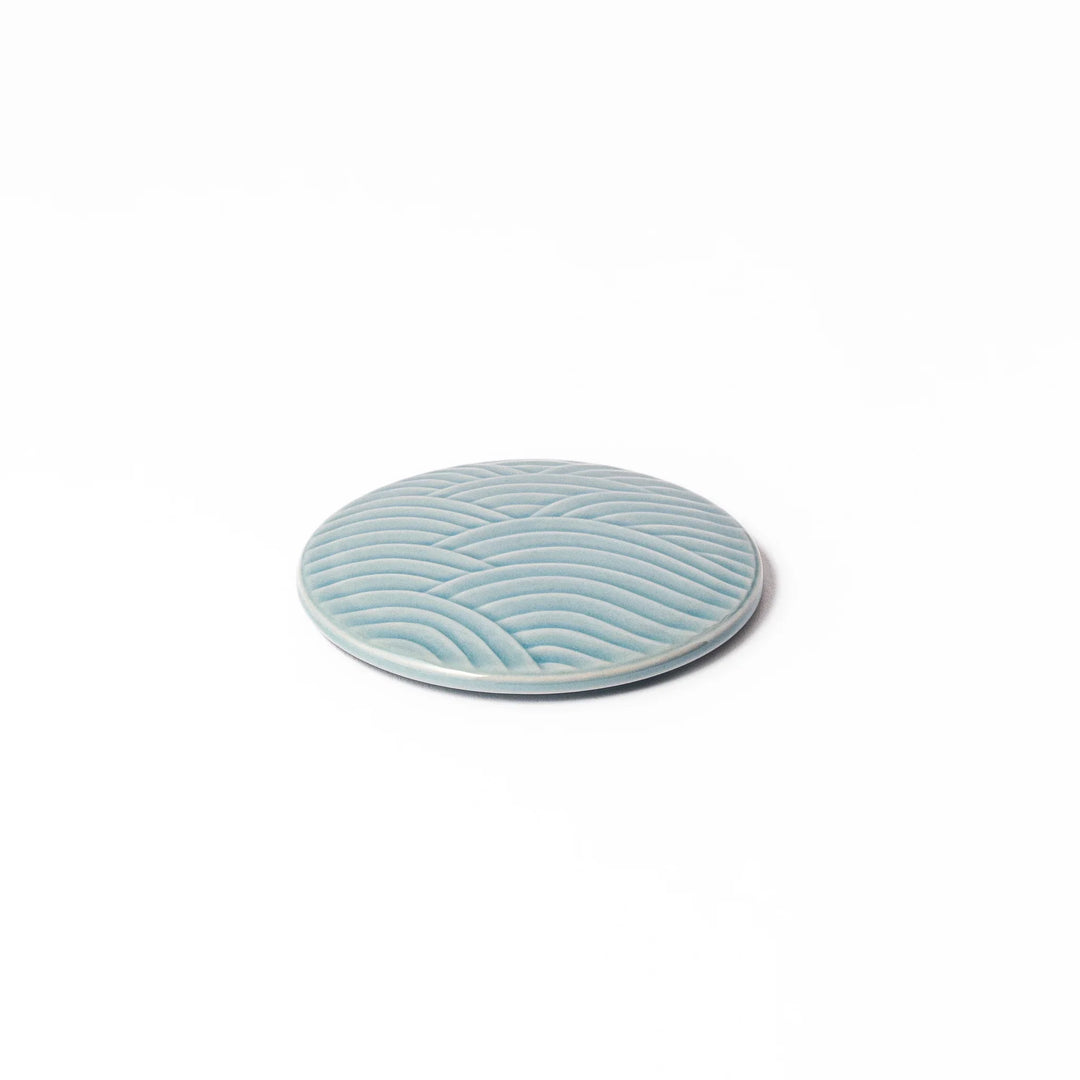 Light blue porcelain lid with embossed Seigaiha wave pattern, crafted to match stackable Japanese bowls beautifully.