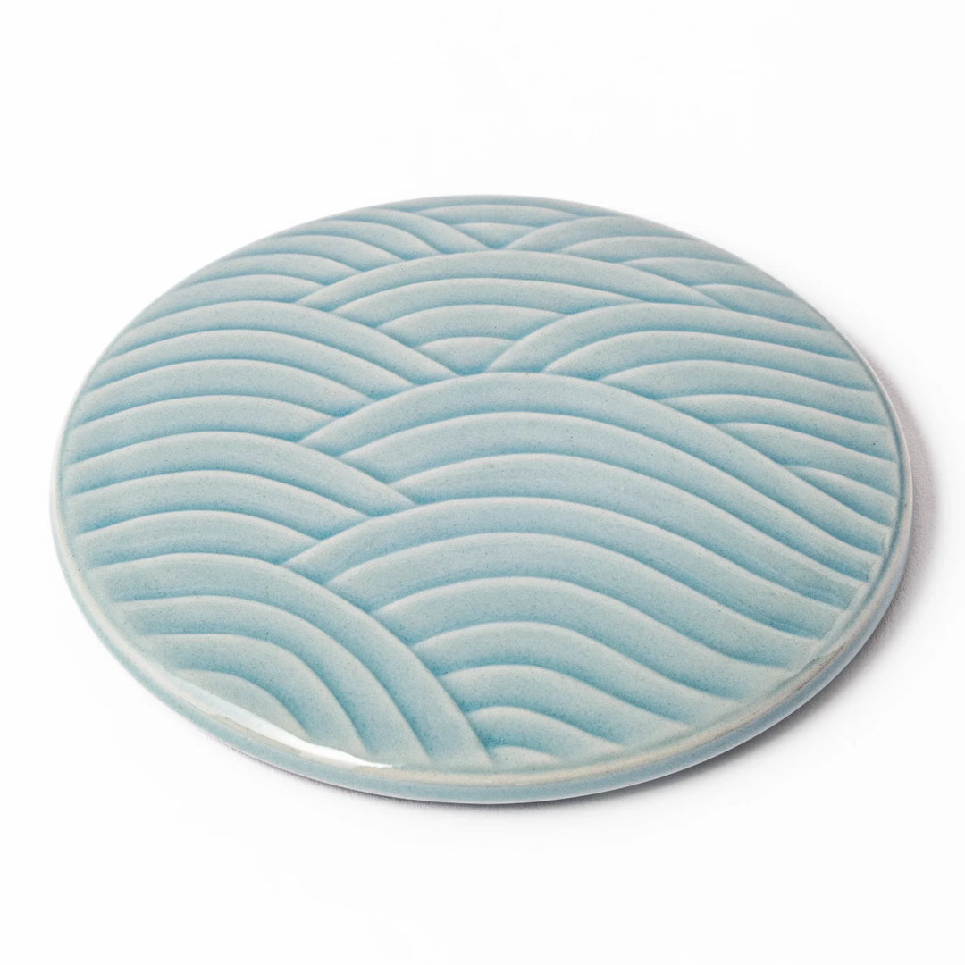 Light blue porcelain lid with embossed Seigaiha wave pattern, crafted to match stackable Japanese bowls beautifully.