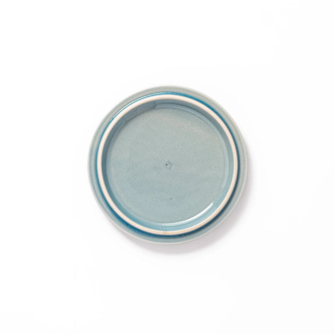 Light blue porcelain lid with embossed Seigaiha wave pattern, crafted to match stackable Japanese bowls beautifully.