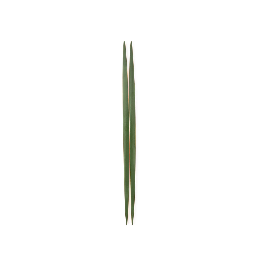 A pair of precision Japanese bamboo cooking chopsticks featuring slim green handles and ultra fine tapered tips for delicate plating