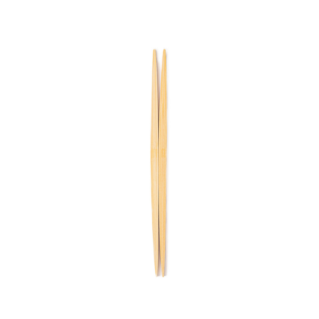 A pair of precision Japanese bamboo cooking chopsticks featuring slim green handles and ultra fine tapered tips for delicate plating