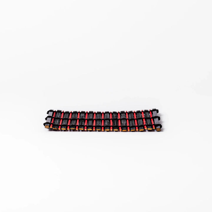 Red and black bamboo coaster with slim vertical slats and black cord ties, ideal for adding a striking accent to Japanese-style drink settings.