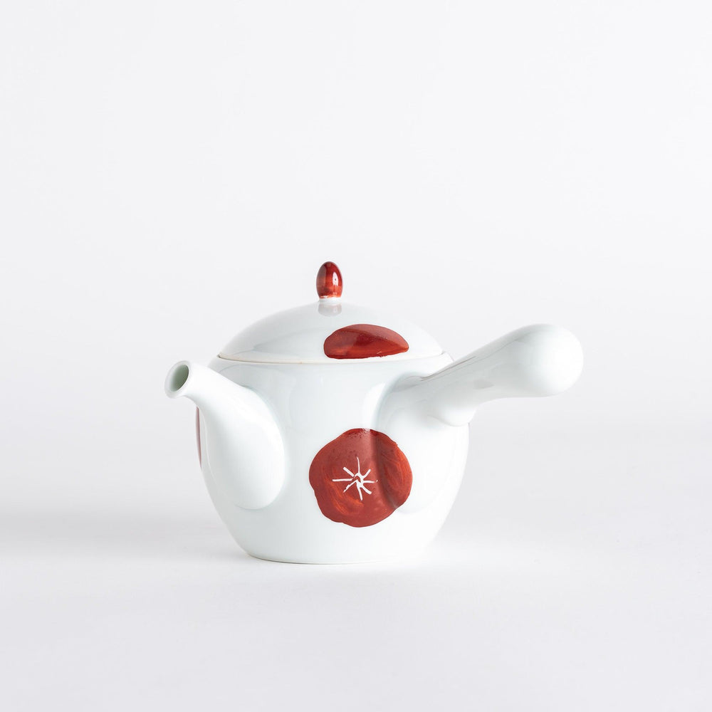 Teapot with a white body and red plum blossom designs, featuring a matching lid and handle, showcasing a traditional yet elegant style.