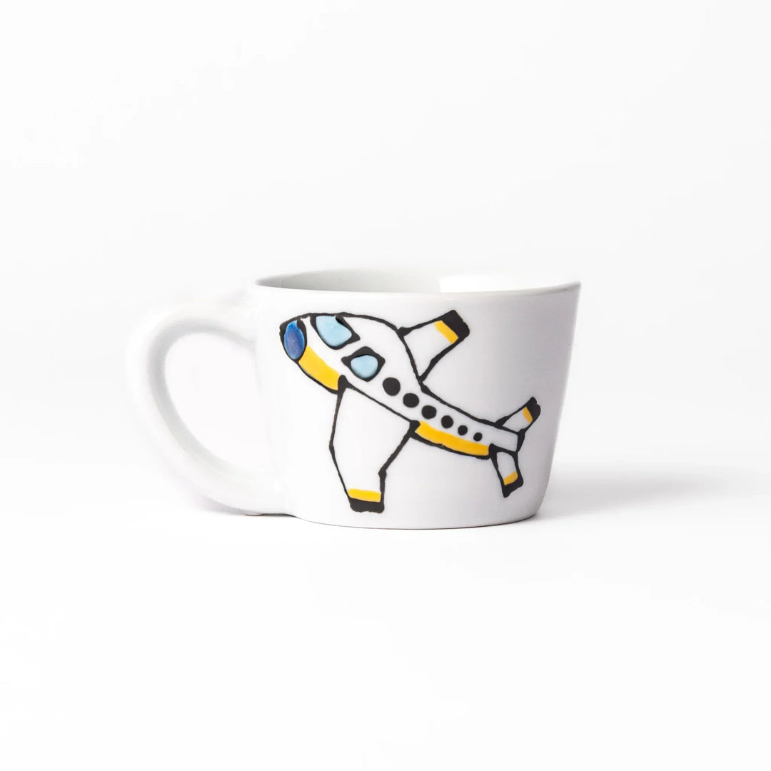 White ceramic kids mug featuring red fire truck with ladder graphic, round handle, shown on white background