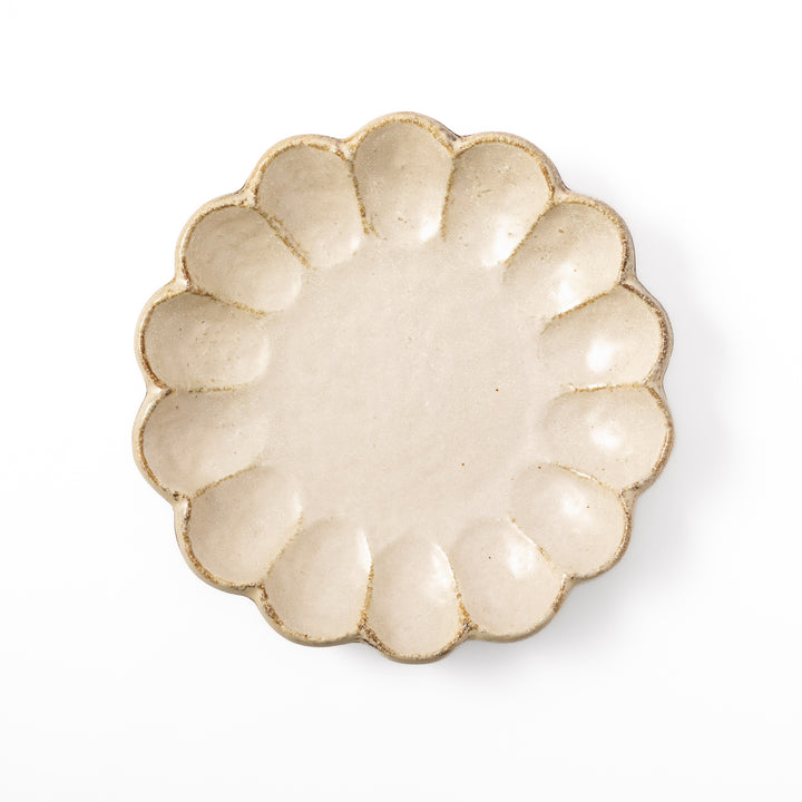 Medium Japanese Rinka ceramic petal salad plate in off white, seen from above, featuring a flower shaped rim