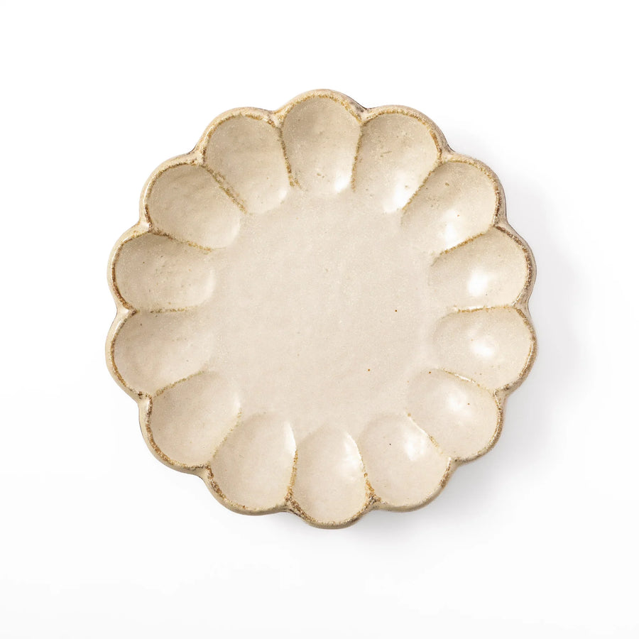Medium Japanese Rinka ceramic petal salad plate in off white, seen from above, featuring a flower shaped rim