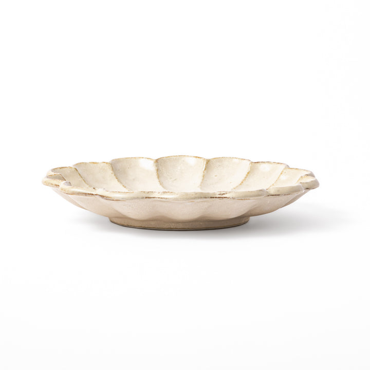 Medium Japanese Rinka ceramic petal salad plate in off white, seen from above, featuring a flower shaped rim
