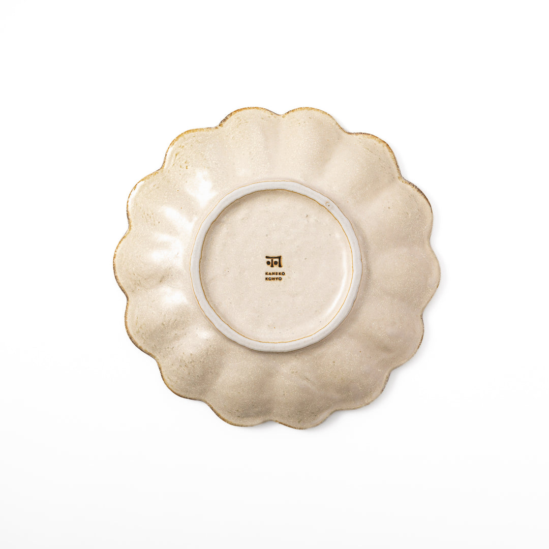 Medium Japanese Rinka ceramic petal salad plate in off white, seen from above, featuring a flower shaped rim