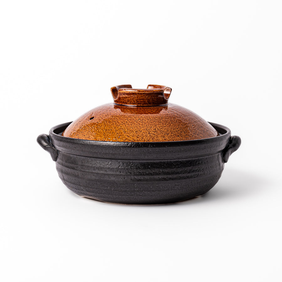 Japanese donabe clay pot with rustic brown glazed lid and black base, induction compatible and ideal for 2–3 person hot pot meals