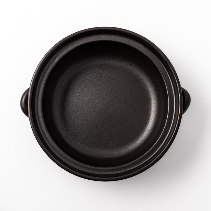 Japanese donabe clay pot with rustic brown glazed lid and black base, induction compatible and perfect for family hot pot meals.