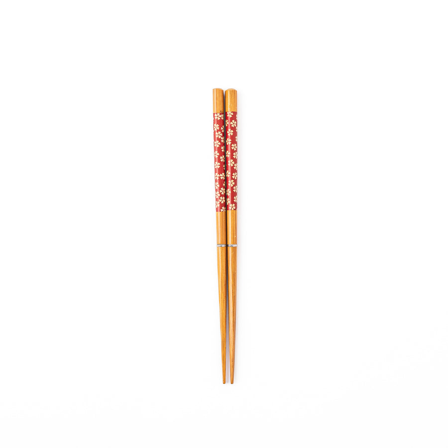 Sakura portable Japanese travel chopsticks featuring a red handle decorated with a traditional cherry blossom pattern