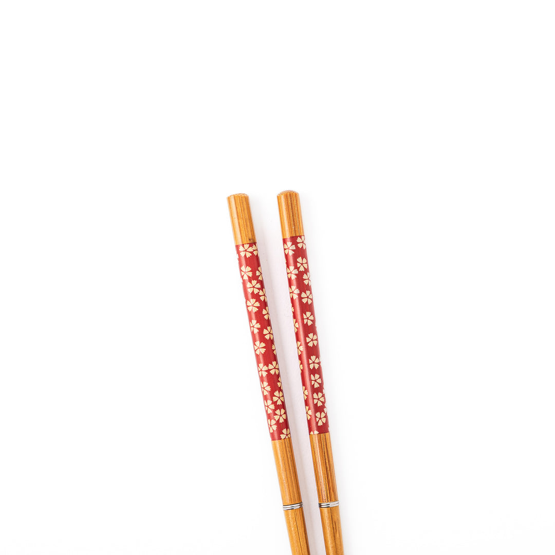 Sakura portable Japanese travel chopsticks featuring a red handle decorated with a traditional cherry blossom pattern