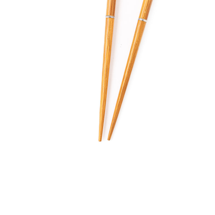 Sakura portable Japanese travel chopsticks featuring a red handle decorated with a traditional cherry blossom pattern