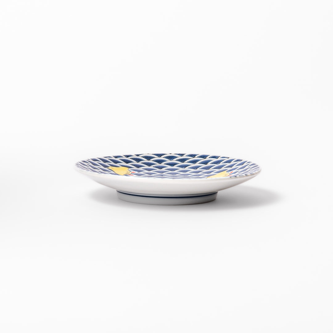 Round Japanese ceramic sauce dish with traditional blue wave pattern and playful yellow shorebirds, perfect for serving soy sauce, condiments, or appetizers.