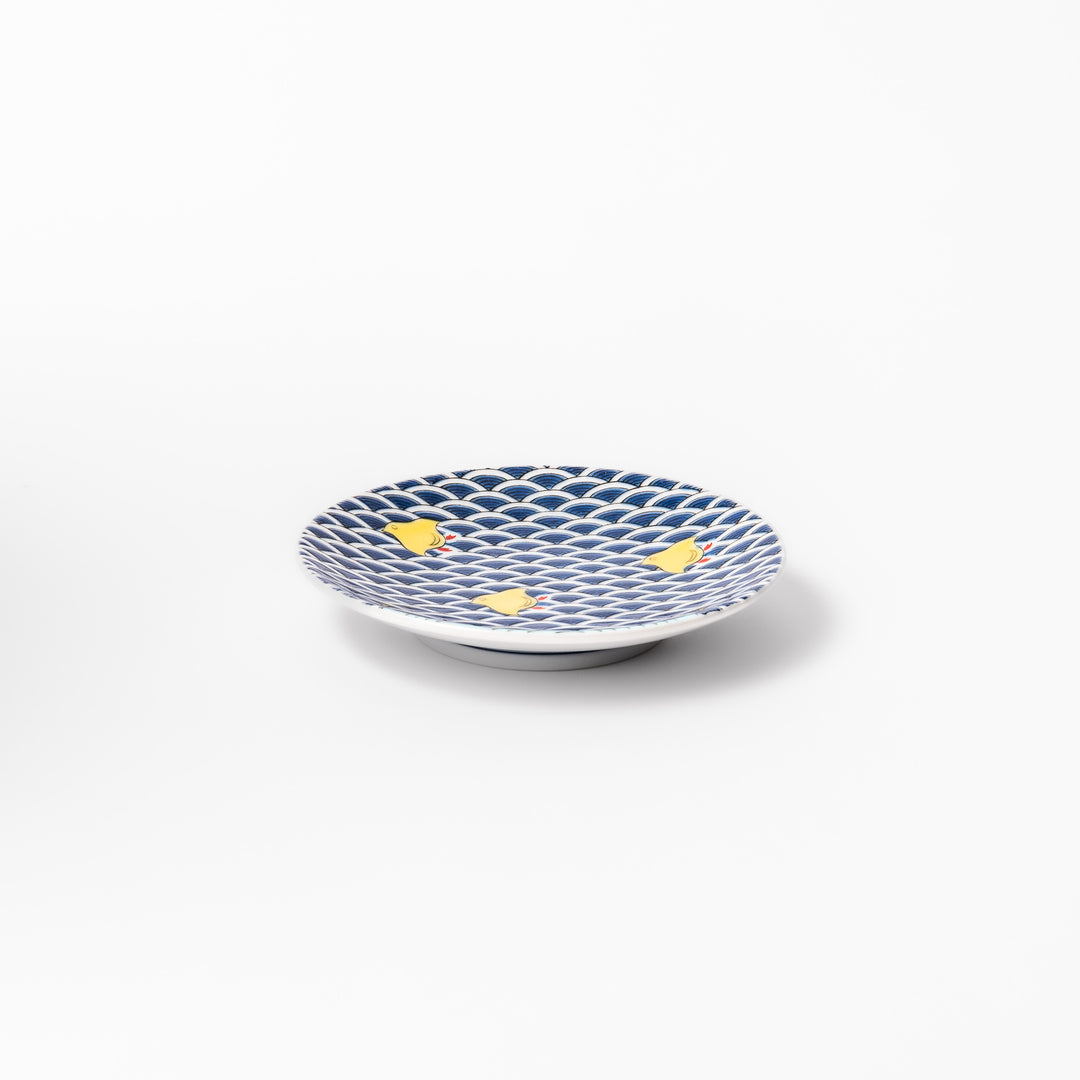 Round Japanese ceramic sauce dish with traditional blue wave pattern and playful yellow shorebirds, perfect for serving soy sauce, condiments, or appetizers.