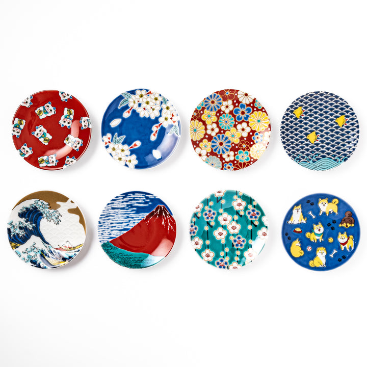 Set of round Japanese ceramic sauce dishes featuring traditional motifs such as waves, Mt. Fuji, cherry blossoms, maneki neko, and playful shiba dogs.