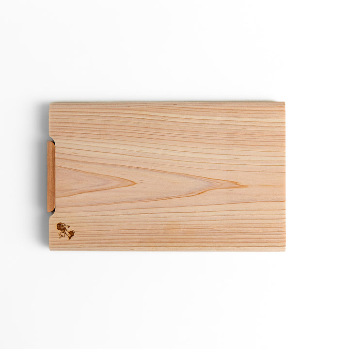 Small Hinoki wood cutting board with smooth grain, natural finish, corner handle, and engraved motif, crafted in Japan
