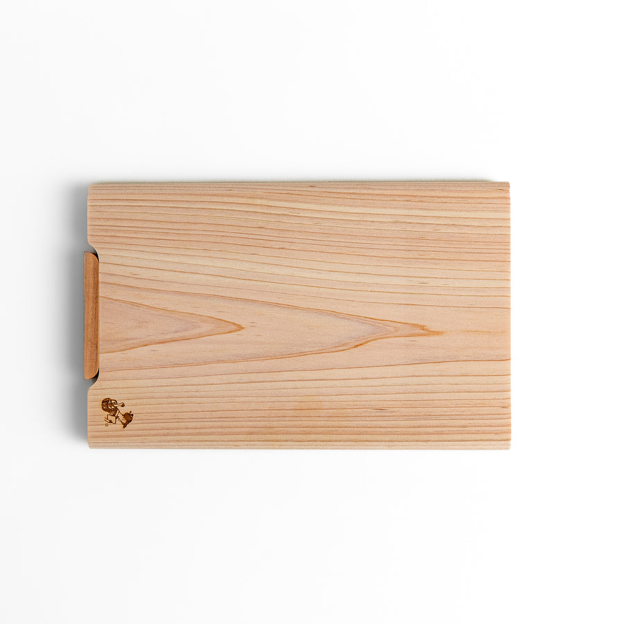 Small Hinoki wood cutting board with smooth grain, natural finish, corner handle, and engraved motif, crafted in Japan