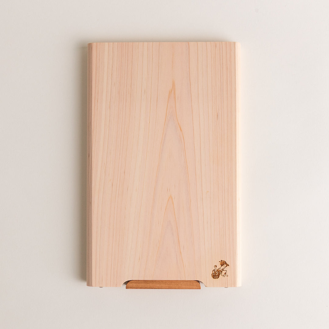 Small Hinoki wood cutting board with smooth grain, natural finish, corner handle, and engraved motif, crafted in Japan