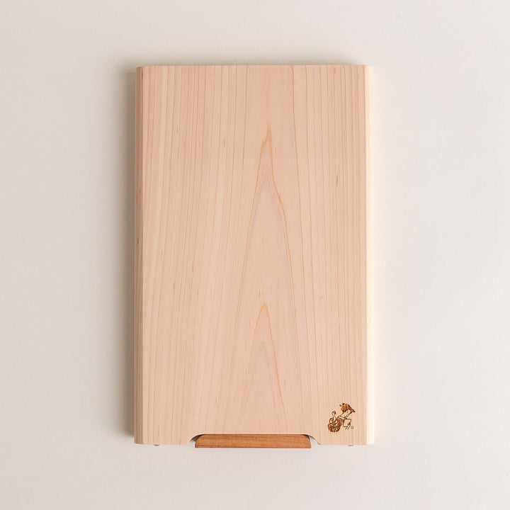 Small Hinoki wood cutting board with smooth grain, natural finish, corner handle, and engraved motif, crafted in Japan