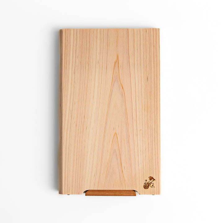 Small Hinoki wood cutting board with smooth grain, natural finish, corner handle, and engraved motif, crafted in Japan