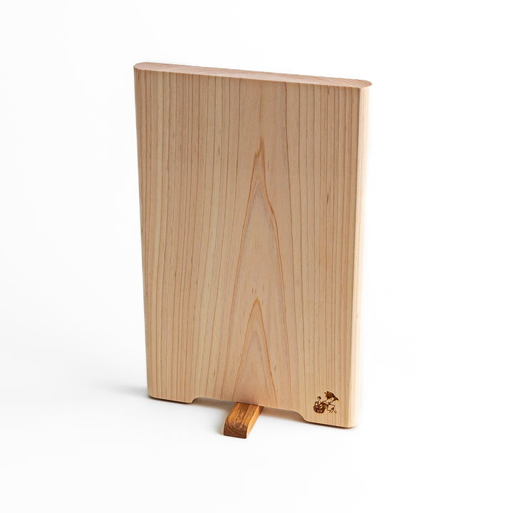 Small Hinoki wood cutting board with smooth grain, natural finish, corner handle, and engraved motif, crafted in Japan