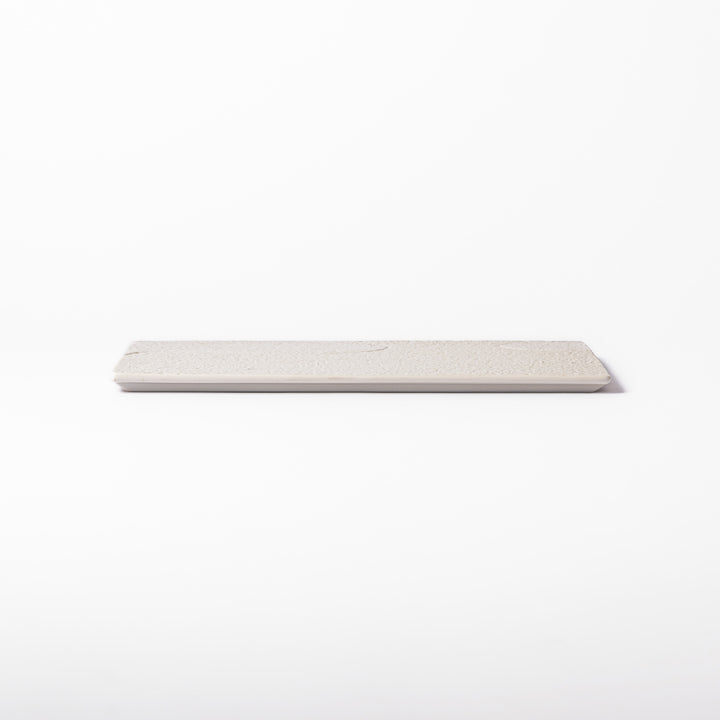 Textured white ceramic dinner plate with subtle ridged lines and matte-gloss contrast, perfect for refined Japanese dining and elegant plating.