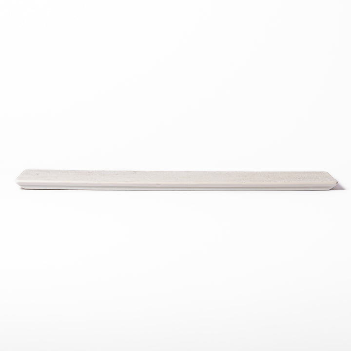 Rectangular white ceramic serving plate with fine ridged texture and soft matte-gloss contrast, ideal for modern Japanese table presentations.