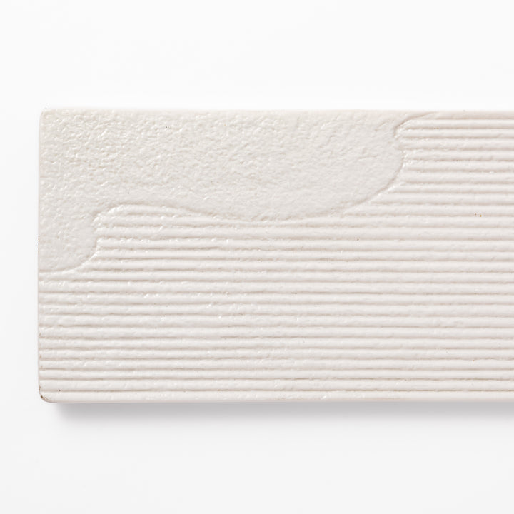 Rectangular white ceramic serving plate with fine ridged texture and soft matte-gloss contrast, ideal for modern Japanese table presentations.