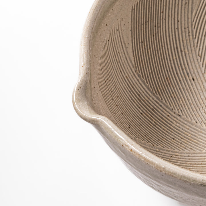 Soft sage-colored mortar with a speckled Hiwa glaze and grooved interior, perfect for grinding sesame or spices.