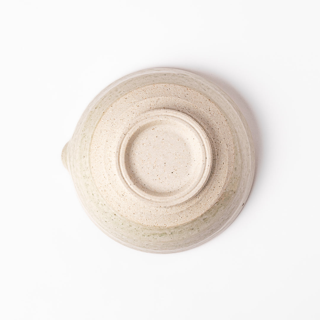 Soft sage-colored mortar with a speckled Hiwa glaze and grooved interior, perfect for grinding sesame or spices.