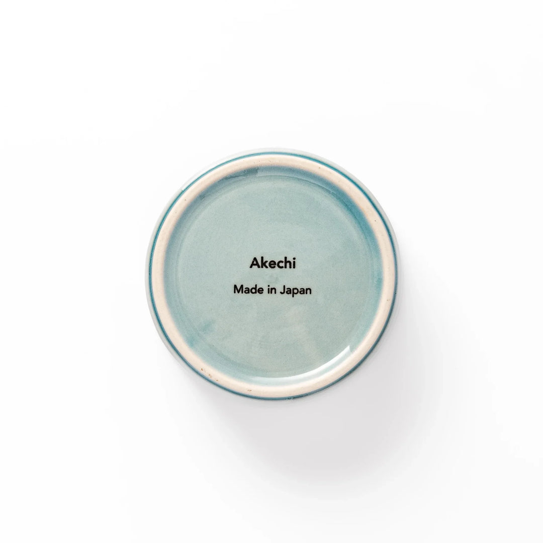 Light blue stackable porcelain bowl with embossed Seigaiha wave pattern, showcasing smooth matte texture and minimalist Japanese design.