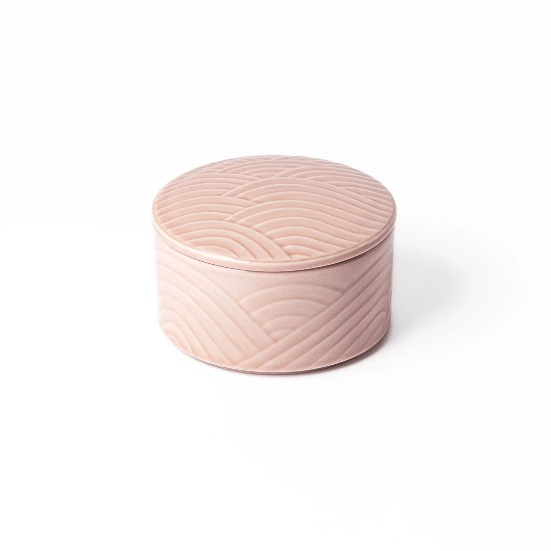 Soft pink porcelain bowl with matching lid, featuring embossed Seigaiha wave motif for a calm, elegant Japanese-inspired design.