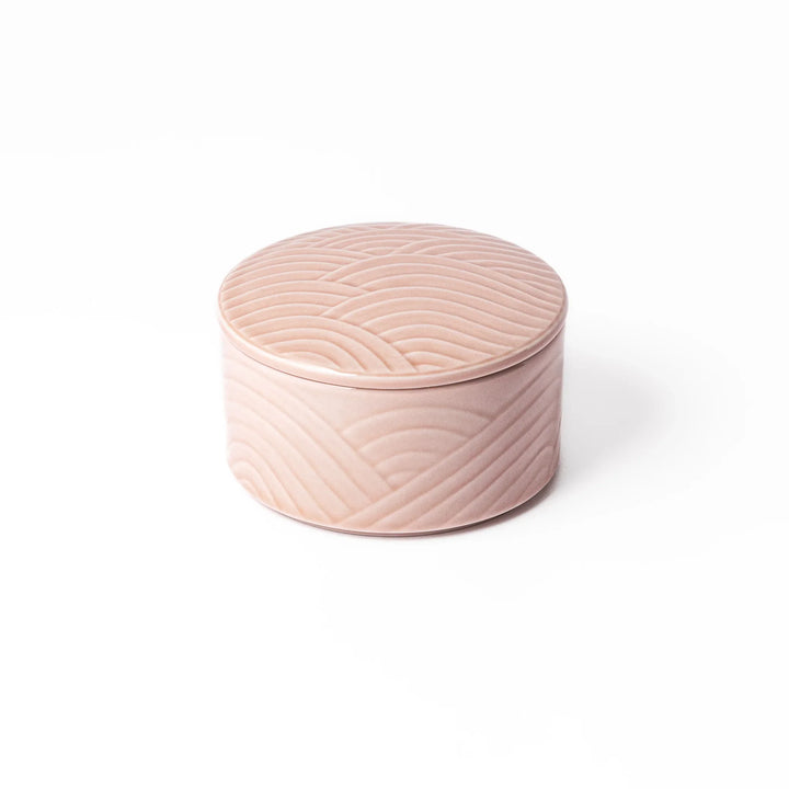 Soft pink porcelain bowl with matching lid, featuring embossed Seigaiha wave motif for a calm, elegant Japanese-inspired design.