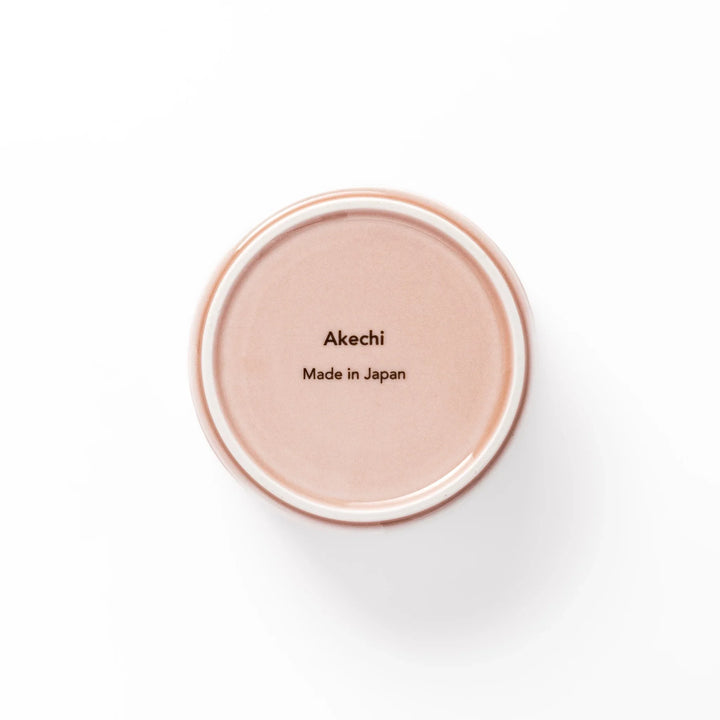 Soft pink stackable porcelain bowl with embossed Seigaiha wave pattern, blending modern simplicity with gentle Japanese warmth.