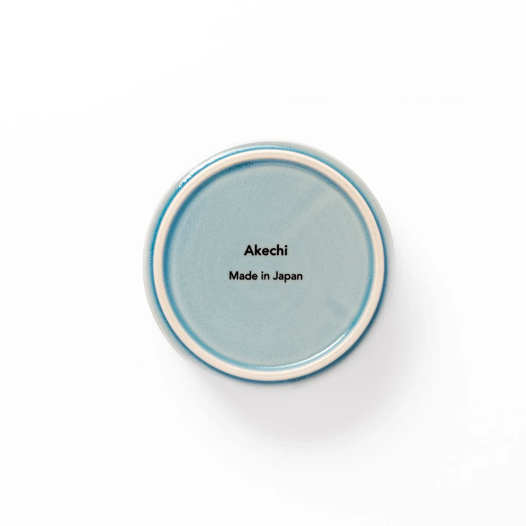 Light blue porcelain bowl embossed with a gentle Seigaiha wave pattern, showcasing a serene and minimalist Japanese design.