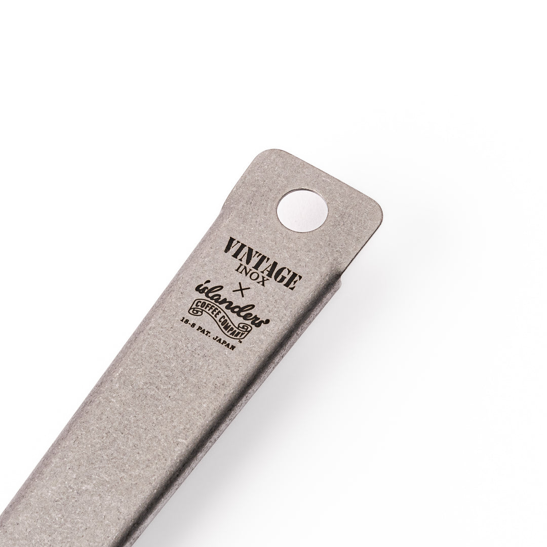 Japanese stainless steel hand coffee roaster with perforated drum and long handle, designed for evenly roasting coffee beans over open flame at home.