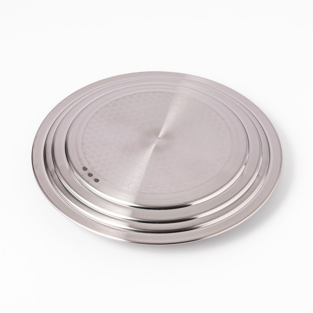 Stainless steel lid with a natural wooden knob designed for Yukihira pots, combining modern simplicity and traditional Japanese craftsmanship for everyday cooking use.