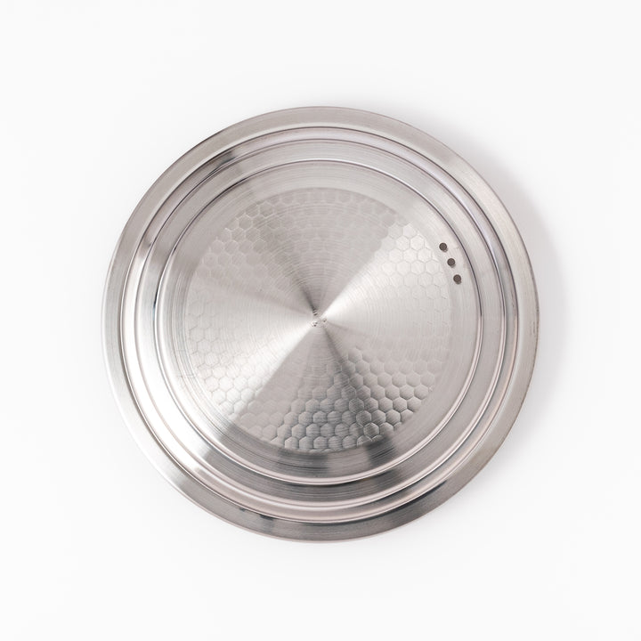 Stainless steel lid with a natural wooden knob designed for Yukihira pots, combining modern simplicity and traditional Japanese craftsmanship for everyday cooking use.