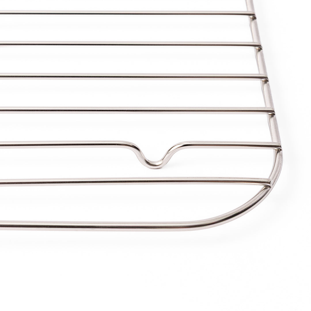 Close up of the rounded corner and raised foot on a Japanese stainless steel prep tray wire rack in large size