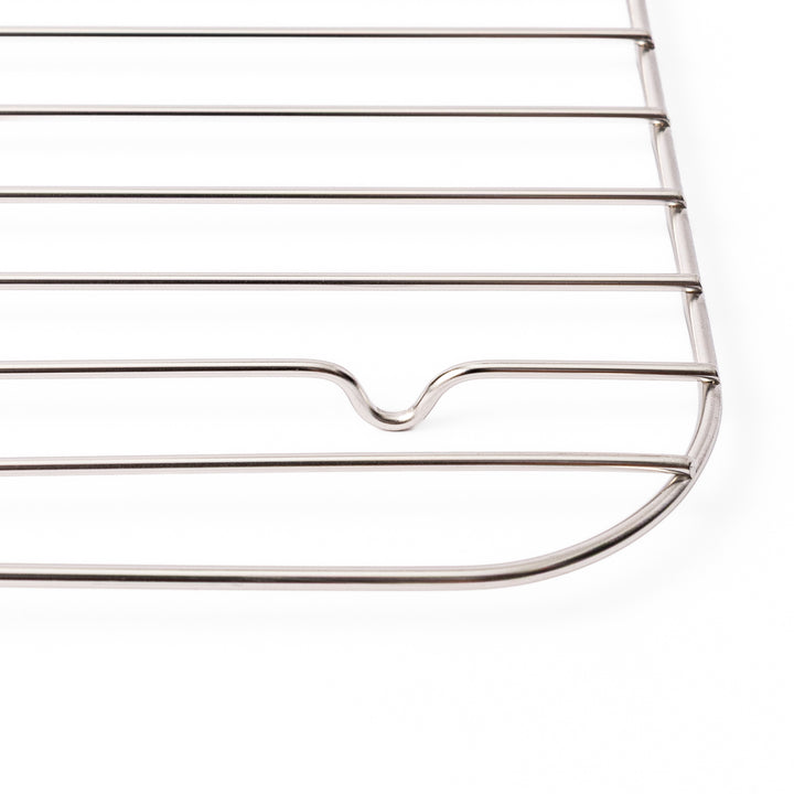Close up of the rounded corner and raised foot on a Japanese stainless steel prep tray wire rack in large size