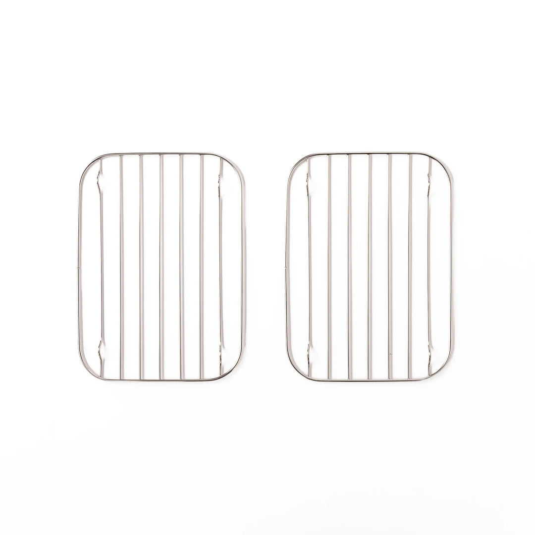 Two small Japanese stainless steel prep tray wire racks with rounded corners and raised feet