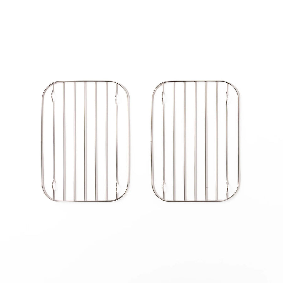 Two small Japanese stainless steel prep tray wire racks with rounded corners and raised feet
