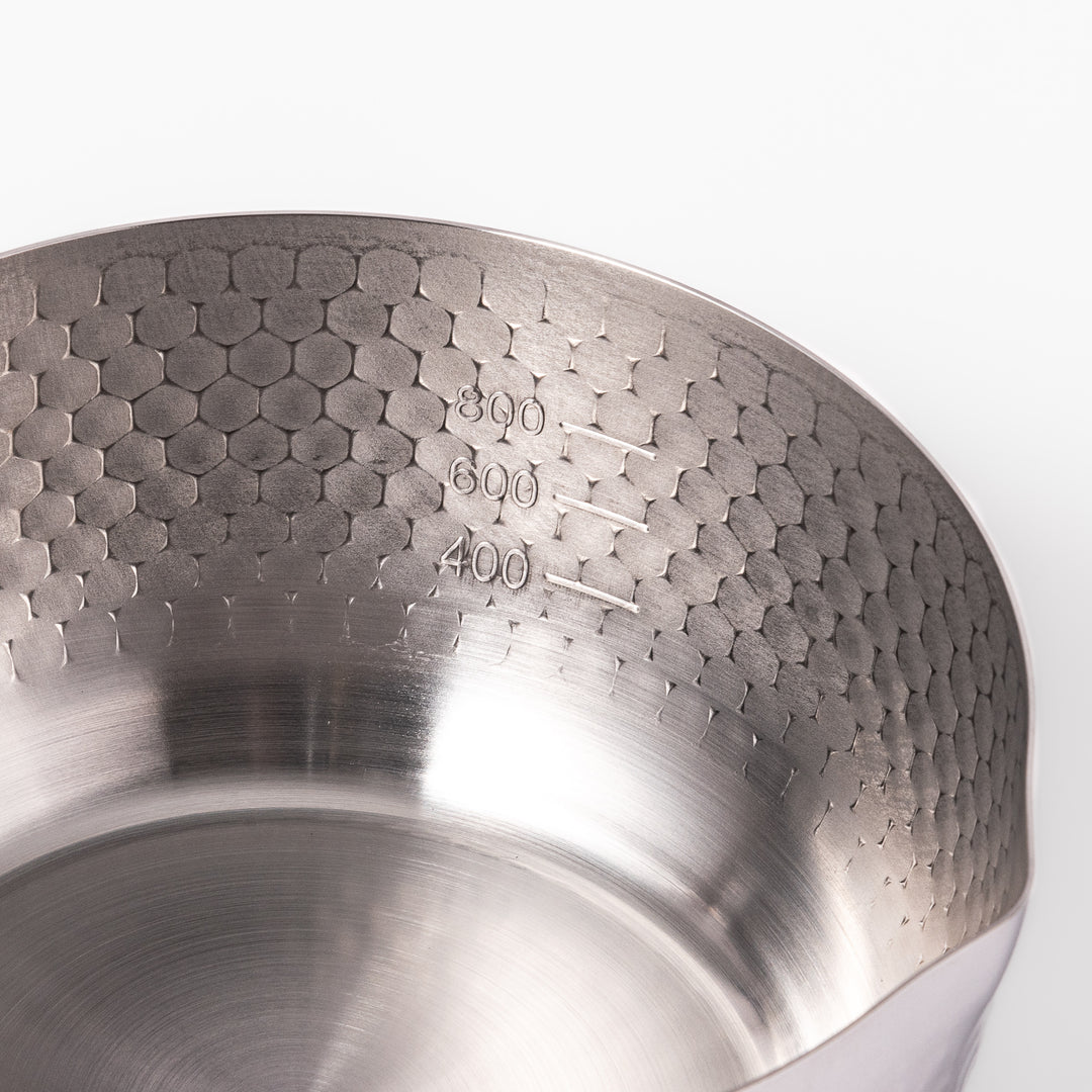 Japanese stainless steel Yukihira pot with a wooden handle and hammered finish, featuring twin pour spouts for easy cooking, simmering, and sauce preparation.