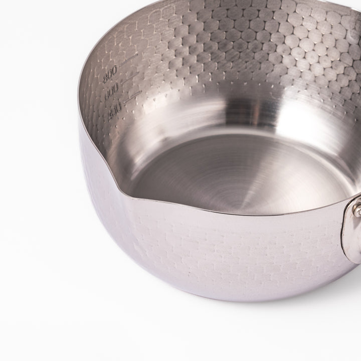 Japanese stainless steel Yukihira pot with a wooden handle and hammered finish, featuring twin pour spouts for easy cooking, simmering, and sauce preparation.